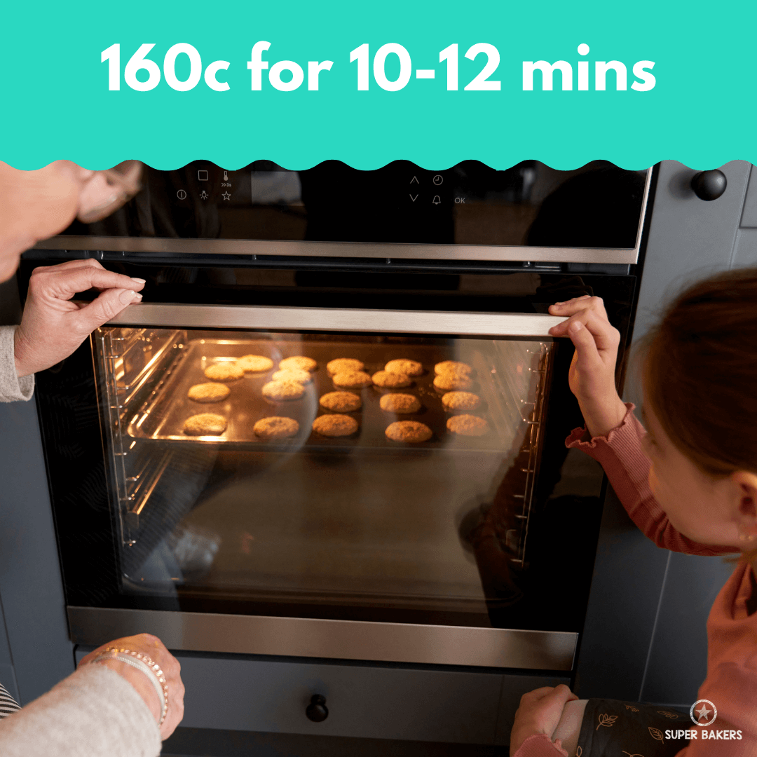 Chocolate Chip Cookie Baking Mix baking in oven at 160 degrees, showing golden brown cookies on baking tray through oven door