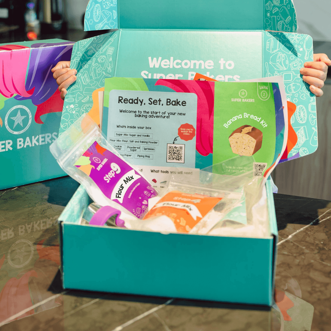 Banana Bread Baking Kit in turquoise box with recipe card and pre-measured ingredients for beginner bakers