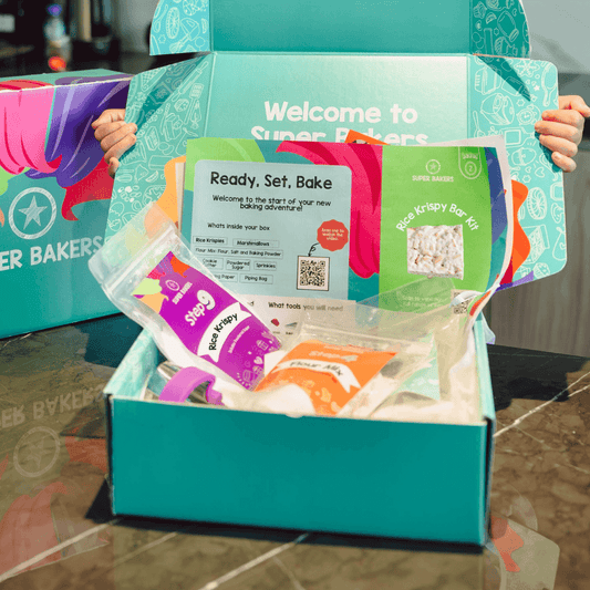 Rice Krispy Bars Baking Mix shown in opened teal subscription box with recipe card and pre-measured ingredients packets