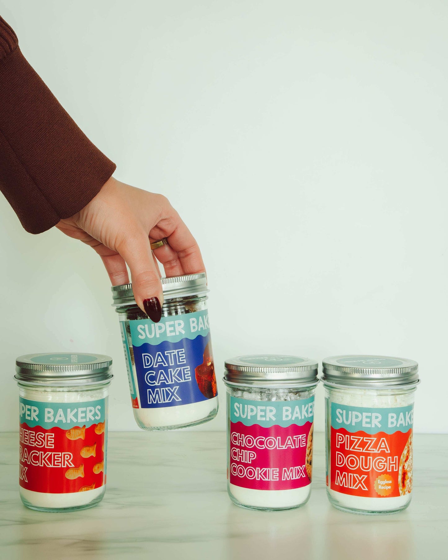 pizza cheese chocolate date mix jars with hand 
